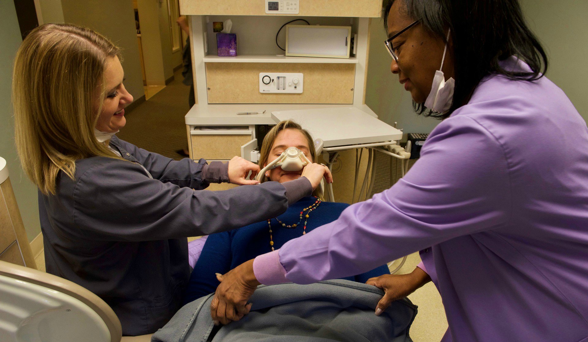 woman enjoys relaxation dentistry in Stow-Munroe Falls community dental practice Munroe Falls Family Dentistry